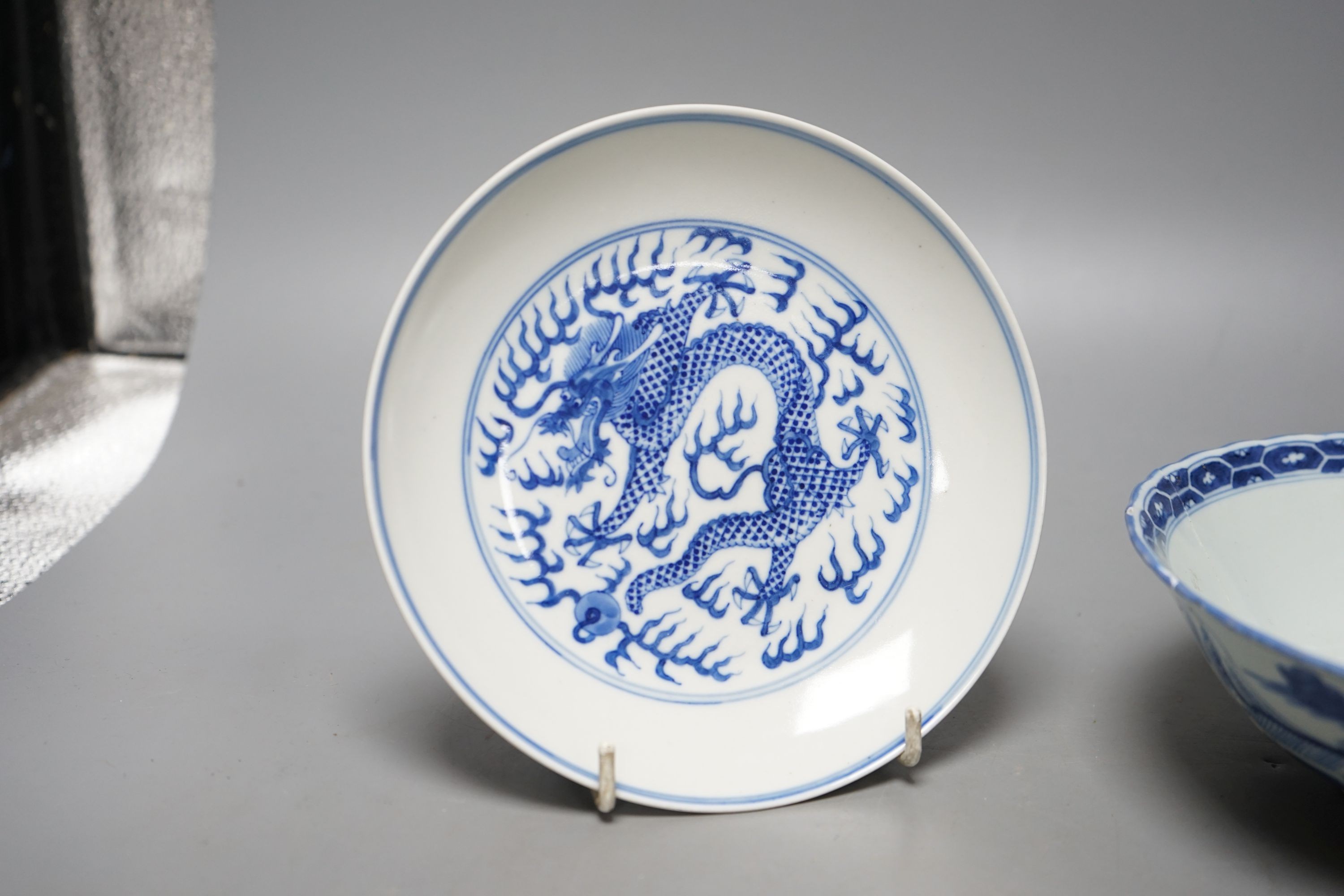 A Chinese blue and white landscape bowl, a/f and a Chinese blue and white 'dragon' dish, 18cm and 16.5cm